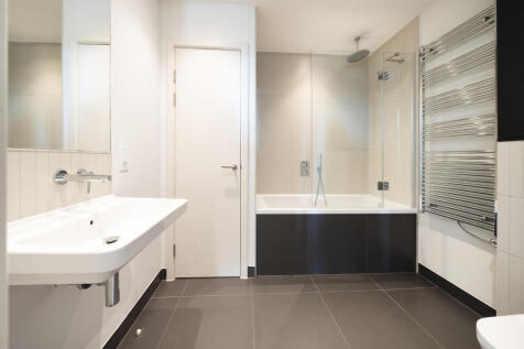 Experience luxury and comfort in this sleek modern bathroom.