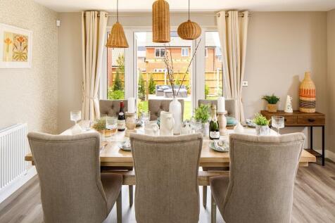 Your dining area looks over your garden through French doors