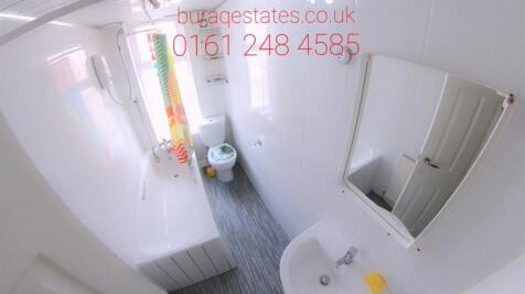 Bright bathroom with full tub and natural light...