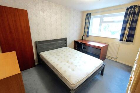 Bright furnished bedroom with a double bed fram...