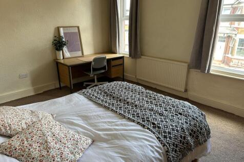 Bright and inviting master bedroom showcasing a...