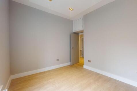 Bright and spacious room with modern wood floor...