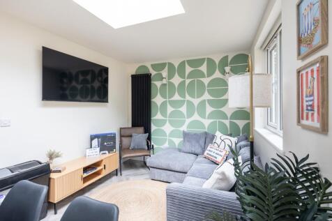 Bright modern lounge with stylish feature wall...