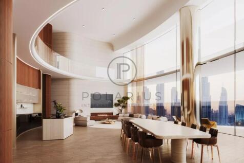 Spacious, modern interior with a high ceiling, lar