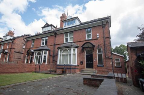 The exterior of an attractive red-brick residen...