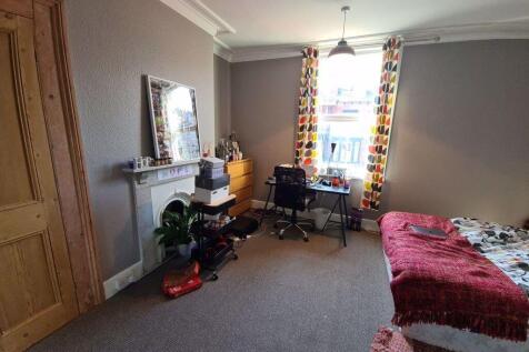 Bright and inviting master bedroom featuring a ...