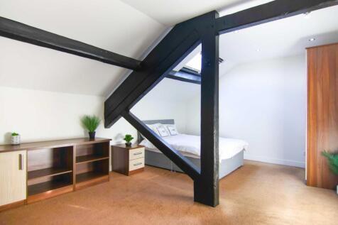 Double bedroom with exposed beams