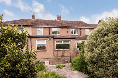 Terraced property with a paved rear garden fram...