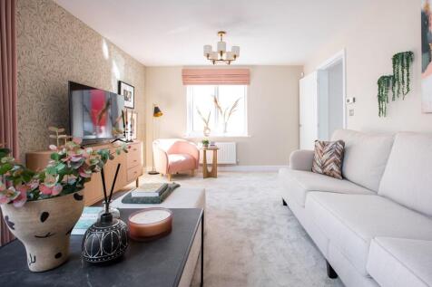 A bright living space to entertain in with large windows and doors to the garden