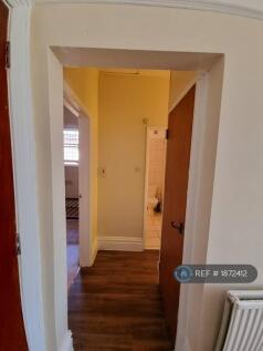 Corridor With Small Storage Cupboard