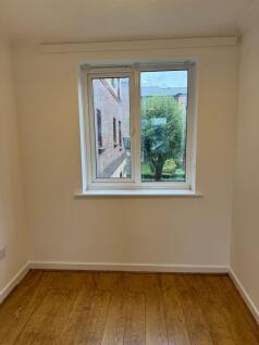 Bright, freshly painted single bedroom with a l...