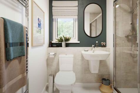An en-suite with full width shower cubicle