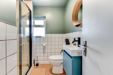 Fresh modern bathroom with a walk-in shower, wh...