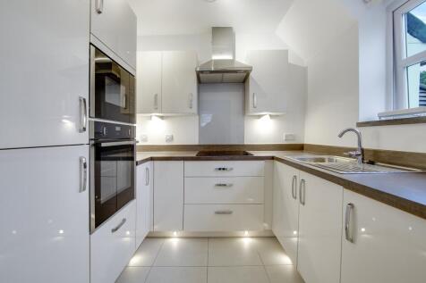 a kitchen with white cabinets