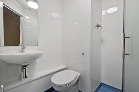 Bright and modern shower room with sleek finish...
