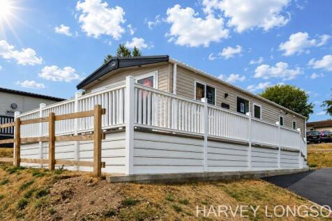 ABI Kingston holiday lodge exterior with decking.