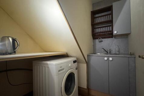 Convenient utility space with washing machine...