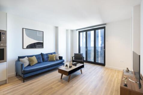 Step into elegance with this modern living room, featuring stylish furnishings and abundant natural light.
