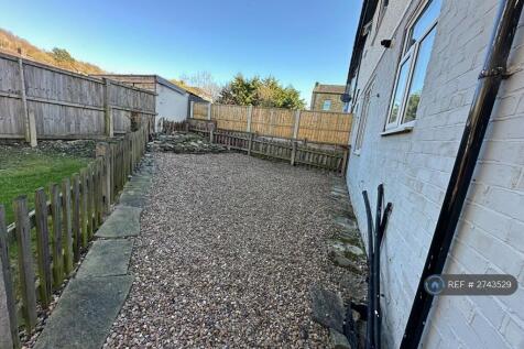 Easily Maintained Rear Garden With Small Rockery 