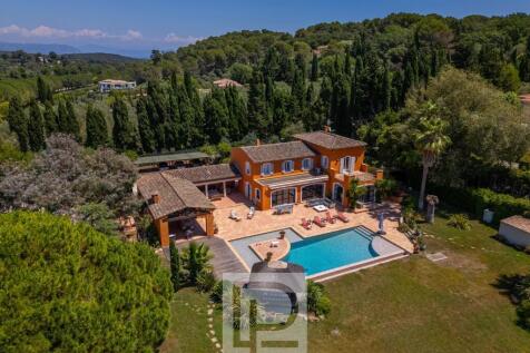 Aerial view of a Mediterranean-style villa with an
