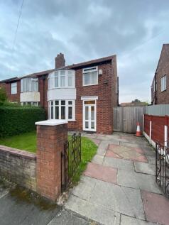 Well-maintained semi-detached brick home with a...