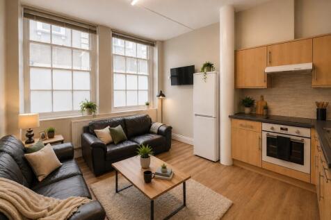Bright open-plan living area with large windows...