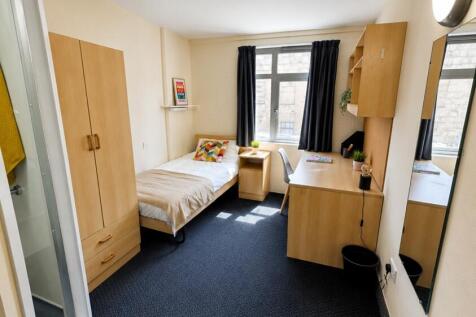 Bright study space with desk and ample storage...