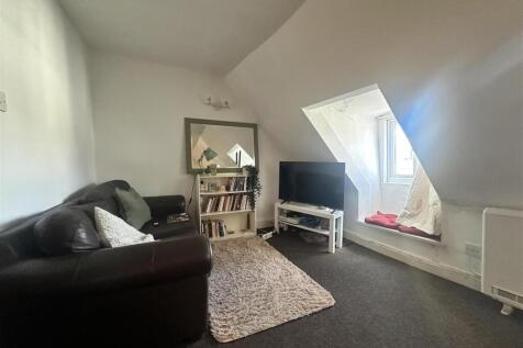 Charming living space with a bright window seat...