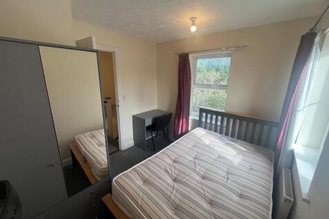 Bright, neatly presented bedroom with a double ...