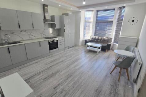 Spacious modern open-plan kitchen and living ar...
