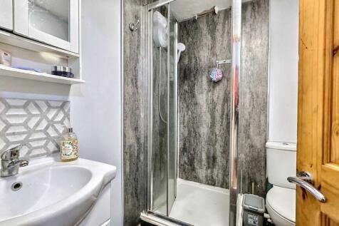 Modern bathroom with stylish tiles and shower....