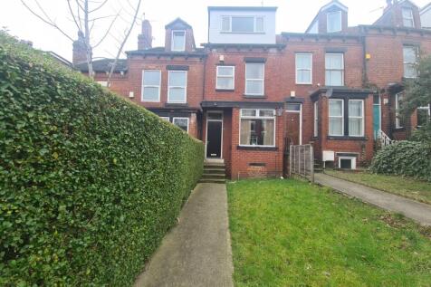 A charming front view of a classic terraced hou...