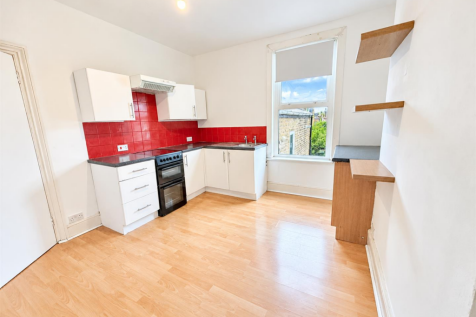 Bright Modern Kitchen with Red Tile Backsplash.png