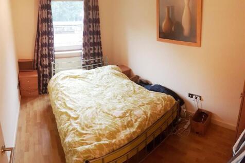 Cosy double bedroom with stylish wood flooring...