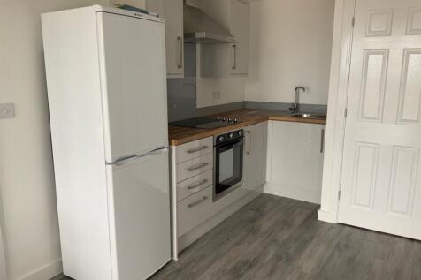 Compact modern kitchen with integrated oven...