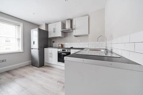 Bright modern kitchen with sleek appliances...