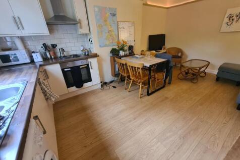 Bright open-plan kitchen with modern appliances...