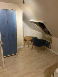 Charming loft room with ample storage space...