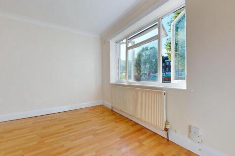 Bright, airy room with elegant wood flooring...