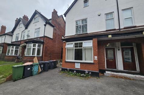 The front exterior of a traditional terraced ho...
