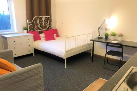 Bright and tidy double bedroom featuring a styl...
