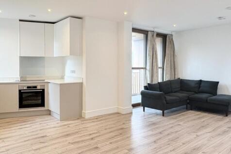 Bright open-plan living area with modern integr...