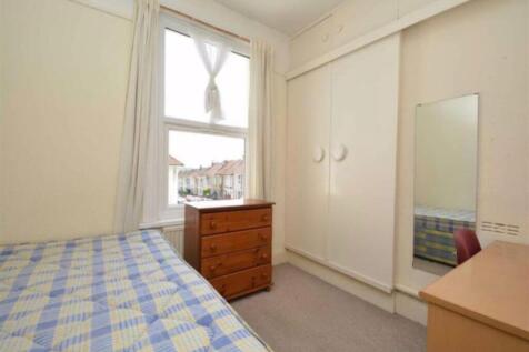 A bright and tidy double bedroom featuring ampl...