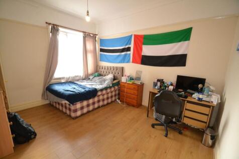 Bright, well-presented bedroom with wooden floo...
