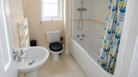 Bright bathroom with bath and natural light....