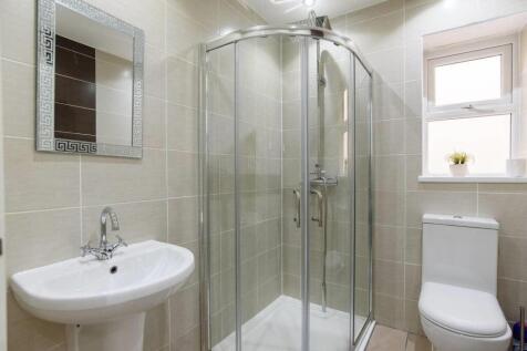 Bright modern shower room with stylish tiling...