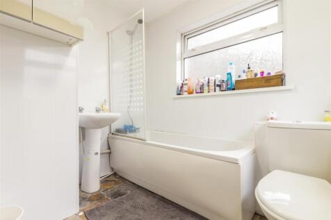 Bright bathroom with bathtub and natural light...