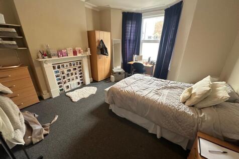 Spacious master bedroom with large bay window...