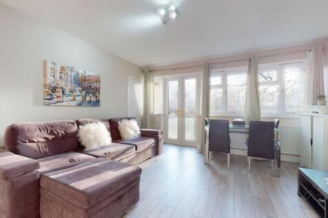 Bright, modern living room with a comfortable L...