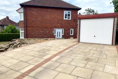 driveway and garage to side.jpg